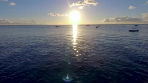 Fly in over the ocean at sunset Stock Footage 220539971