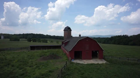 Fly over old barn on farm with horses Stock Footage 24586822