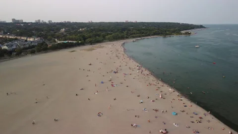 A fly-over of one of Toronto's public beaches in late summer Stock Footage 163327416