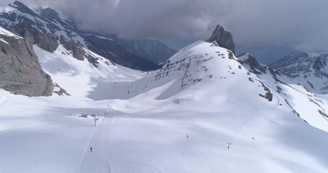 Fly over Ovronnaz slopes, dark weather - Aerial 4K Stock Footage 106232181