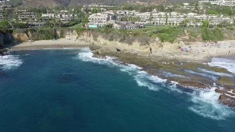 Fly over Pacific ocean in Laguna beach with luxury resort view Stock Footage 73719075