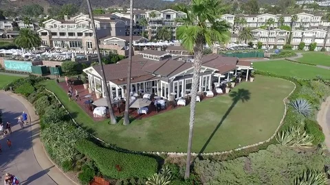 Fly over Pacific ocean in Laguna beach with luxury resort view Stock Footage 73719080