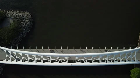 A fly-over of a pedestrian bridge Stock Footage 163140070