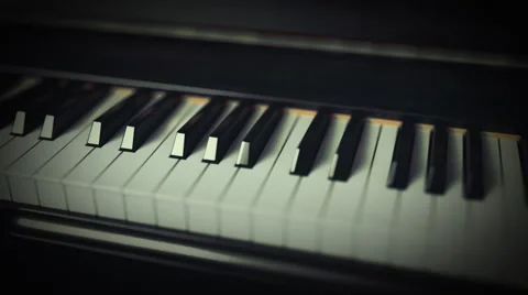 Fly over piano keys shallow depth of field Stock Footage