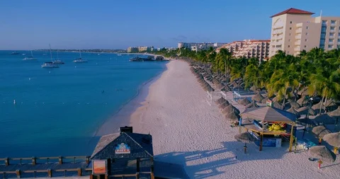 Fly over pier empty beach with no tourist due to corona crisis. Stock-Footage 128472578