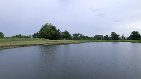 Fly over pond on golf course, drone view Stock Footage 201311159