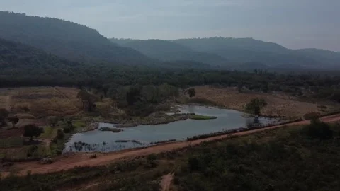 Fly over pond with mountain view drone shot in Khao Yai, thailand Stockbeeldmateriaal 148847325