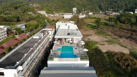 Fly over the pool, hotel in Karon, turquoise water, relaxation Asia, rooftop bar Stock Footage 246844500
