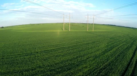 Fly over power lines. Flying over an agricultural field Video stock 63517740