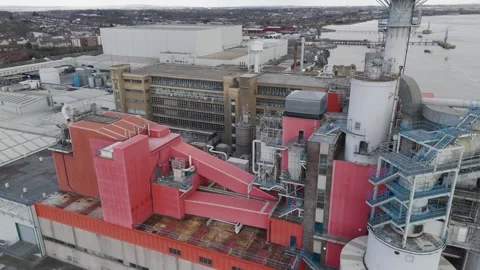 Fly-over of Procter and Gamble industrial site featuring red process towers Stock Footage 310600278