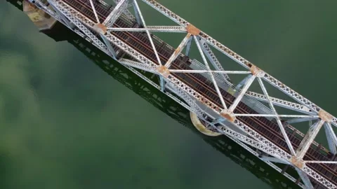 Fly over railway bridge over the river at dawn Stock Footage 145165285