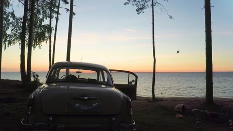 Fly Over Retro Car On The Beach At Sunset - Aerial Footage Stock Footage 90089854