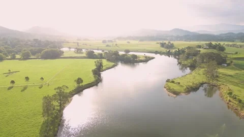 Fly over the river with extremely bright background sun 스톡 동영상 267808661