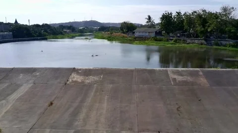 Fly over the river flow in the city Video stock 288662479