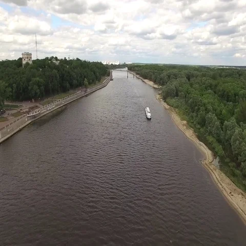 Fly over river in Gomel Belarus aerial 4K cruise boat and city embankment park Stock Footage 69542952