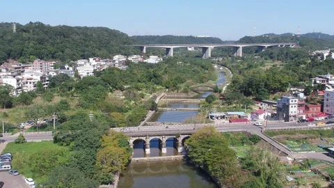 Fly over a river surrouned by trees and trails Stock Footage 101653336