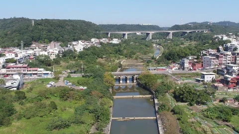 Fly over a river surrouned by trees and trails Stock Footage 101723023