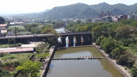 Fly over a river surrouned by trees and trails Stock Footage 101723791