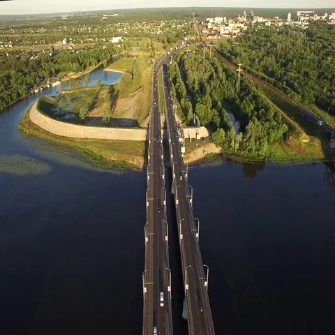 Fly over road bridge connecting sides of Sozh river in Gomel Belarus aerial view Video stock 69542848