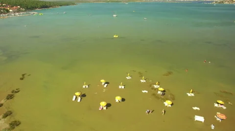 Fly over shallow water beach to the sea Stock Footage 53674695
