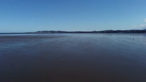 Fly over shallow water on beach Stock Footage 152050669