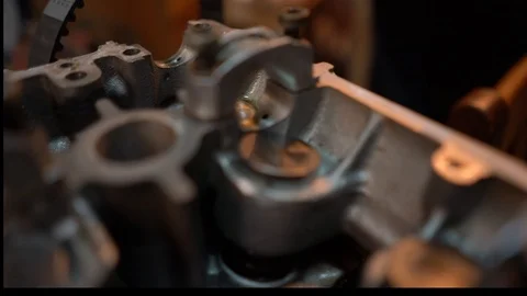 Fly over shot of 4 valve engine head without camshafts. Stock Footage 99337532