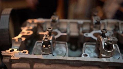 Fly over shot of 4 valve engine head without camshafts. Stock Footage 99337581