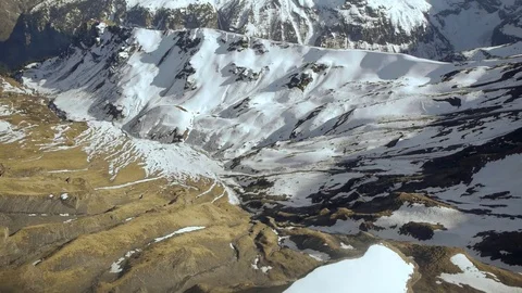 Fly over snowcapped mountain panorama winter landscape alps glaciers Stock Footage 74088980