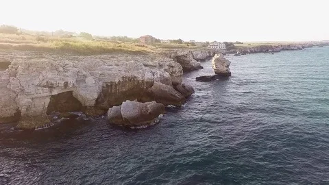 Fly over the stone arch (bridge) on the shore of Tyulenovo Stock Footage 80903278