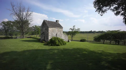 Fly over stone house circa 1850 Stock Footage 24589898