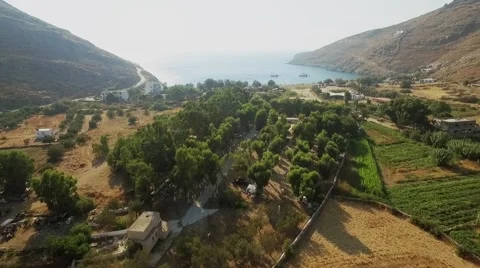 Fly over the summer valley to the beach, aerial footage Cyclades islands Greece Video stock 55522015
