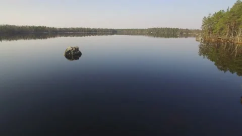 Fly over surface of a beautiful lake Stock Footage 165624381