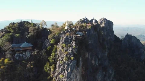 Fly up over Temple at cliff on top of Mountain, wat chaloem lampang Chiang mai Stock Footage 237819908
