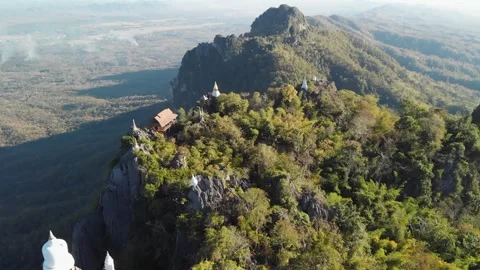 Fly up over Temple at cliff on top of Mountain, wat chaloem lampang Chiang mai Stock Footage 237819916