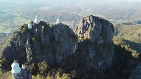 Fly up over Temple at cliff on top of Mountain, wat chaloem lampang Chiang mai Stock Footage 237819940