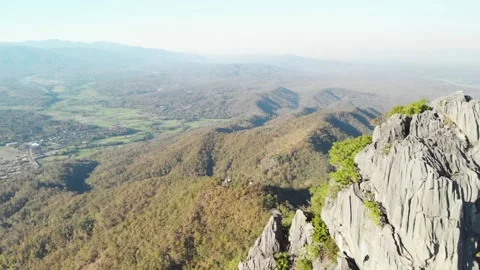 Fly up over Temple at cliff on top of Mountain, wat chaloem lampang Chiang mai Stock Footage 237819947