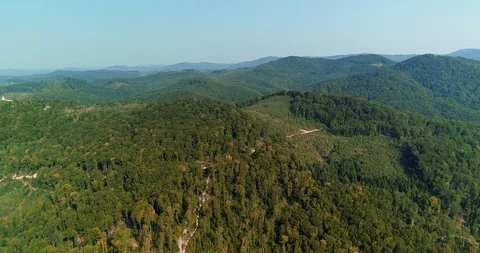 Fly over thin winding path on hill slope, leading to the top of the mountain. Stock Footage 127241743