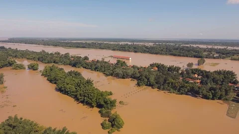 Fly over tiny villages surrounded by flooded agricultural fields Stock Footage 87453936