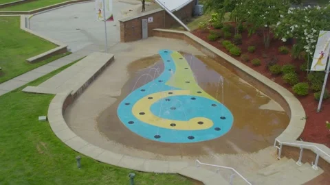 Fly over top down view of water fountain with rhythm spouts movement Stock Footage 171134560