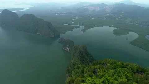 Fly over the top of the mountain directly over the tree. Thailand Sightseeing  Stock Footage 153062665