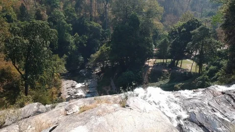 Fly over the top of a waterfall Video stock 127949702