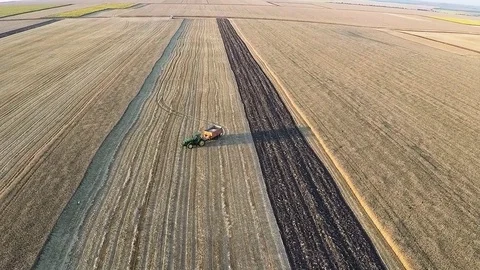 Fly over a tractor with a trailer full of wheat Stock Footage 81255258