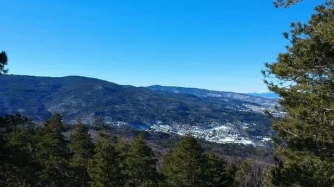 Fly over trees in a winter mountain Stock Footage 85136605