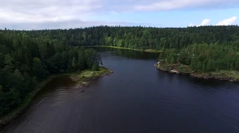 Fly over water and forest on island of Valaam. Aerial view. 스톡 동영상 67112945