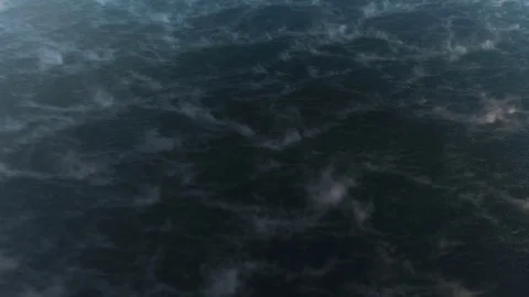 Fly over the water surface: dark water freezes, the sunset reflects. Stock Footage 85294724