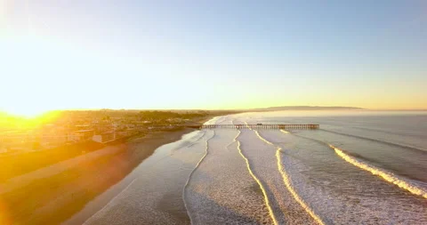 Fly Over Waves Towards Pier At Sunrise. Closer to Pier. 4k Aerial Stock Footage 145234552