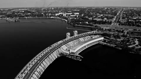 Fly over the weir and power lines of water-power plant. Aerial establishing shot Stock Footage 219894742