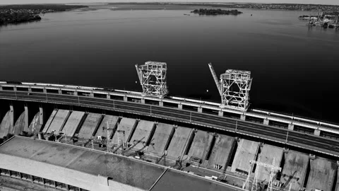 Fly over the weir and power lines of water-power plant. Aerial establishing shot Stock Footage 219894962