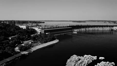 Fly over the weir and power lines of water-power plant. Aerial establishing shot Stock Footage 219894972