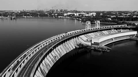 Fly over the weir and power lines of water-power plant. Aerial establishing shot Stock Footage 219895110